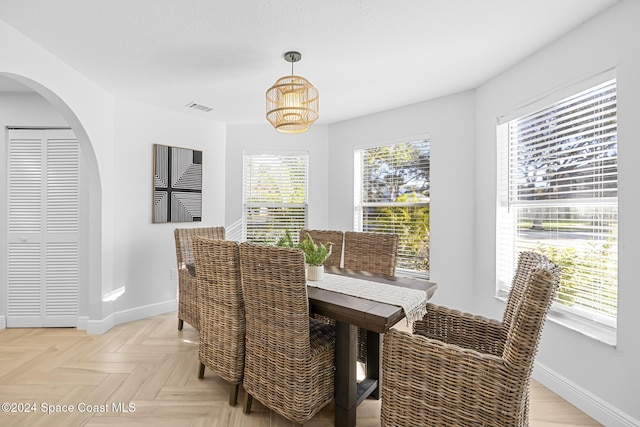 dining room with light parquet flooring