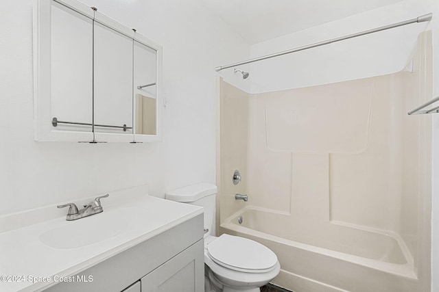 full bathroom with bathing tub / shower combination, vanity, and toilet