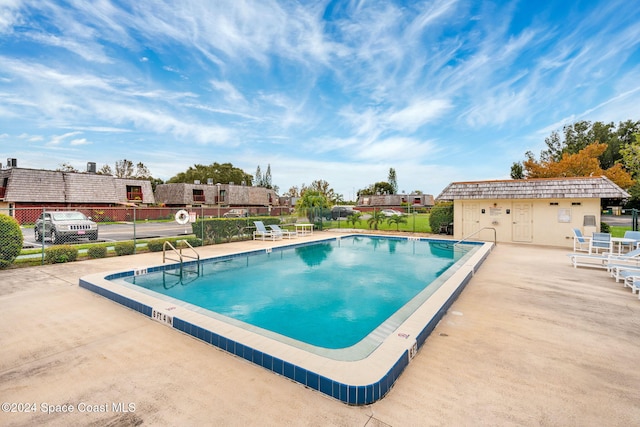 view of pool featuring a patio area