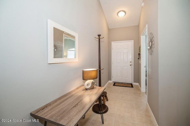 hallway with light tile patterned floors