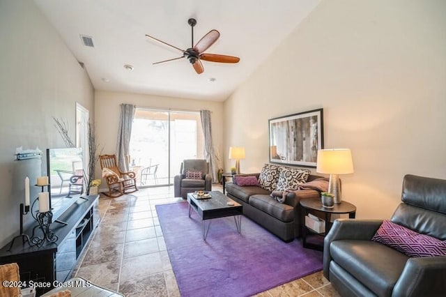 tiled living room featuring high vaulted ceiling and ceiling fan