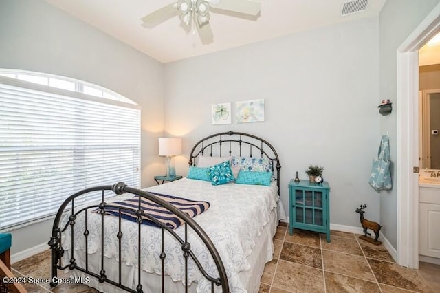 bedroom featuring ceiling fan and ensuite bathroom