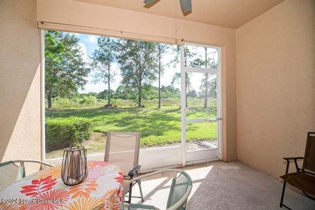 sunroom / solarium with ceiling fan