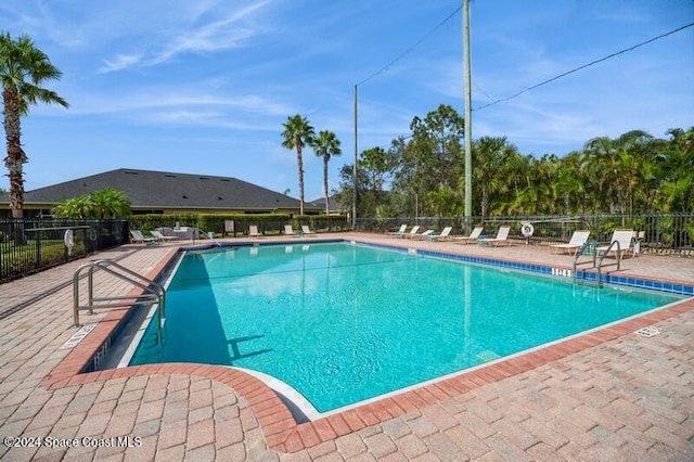 view of pool featuring a patio