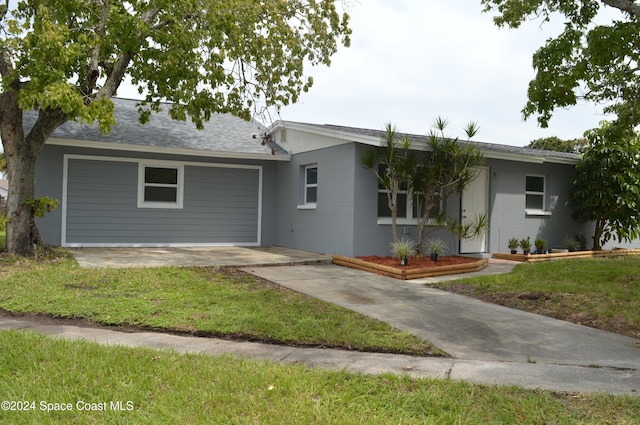 ranch-style house with a garage and a front yard