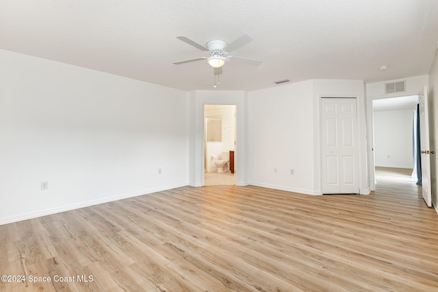 spare room featuring ceiling fan, a textured ceiling, and light wood-type flooring