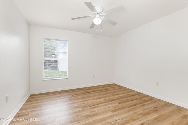 empty room featuring ceiling fan and light hardwood / wood-style floors