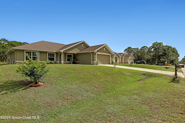 ranch-style home featuring a front yard and a garage