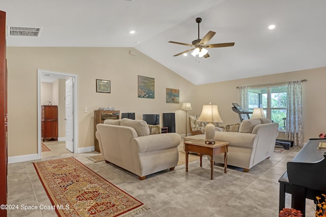 living room featuring ceiling fan and vaulted ceiling