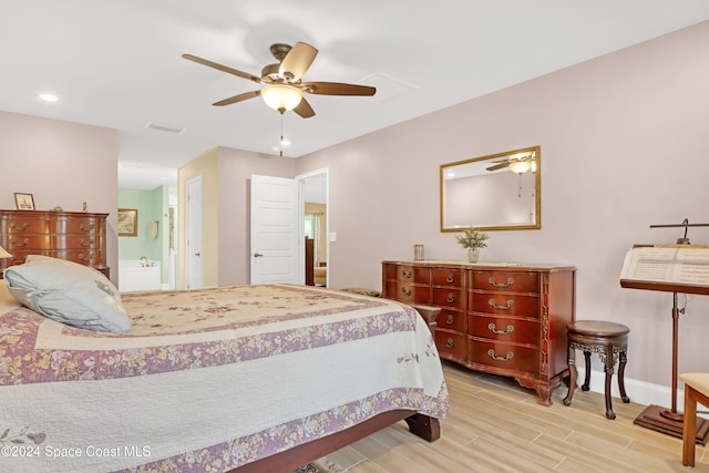 bedroom with ceiling fan and connected bathroom