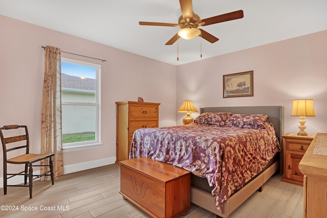 bedroom featuring ceiling fan and light hardwood / wood-style floors