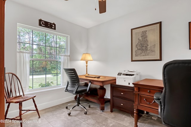 tiled home office featuring ceiling fan