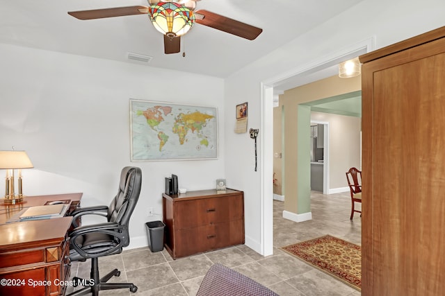 office space with ceiling fan and light tile patterned floors