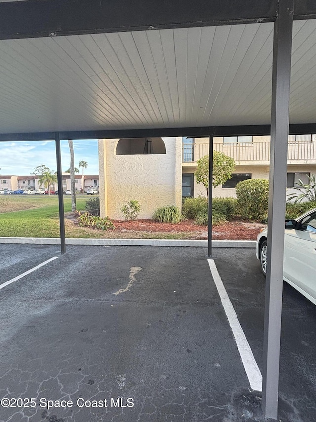 view of parking / parking lot with a carport