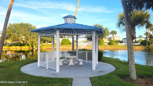 view of patio / terrace with a water view and a gazebo