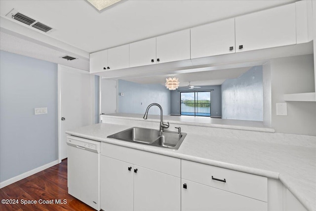 kitchen featuring dishwasher, sink, dark hardwood / wood-style floors, and white cabinets