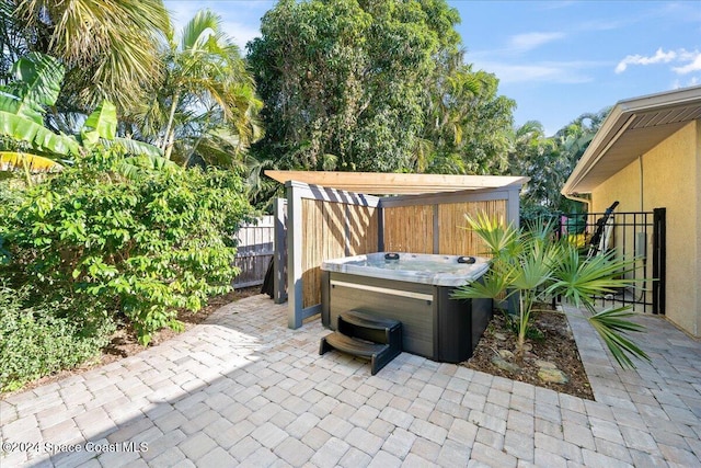 view of patio with a hot tub