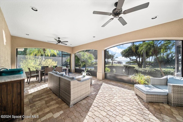 view of patio featuring outdoor lounge area and ceiling fan