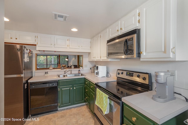 kitchen featuring sink, stainless steel appliances, green cabinets, white cabinets, and light tile patterned flooring