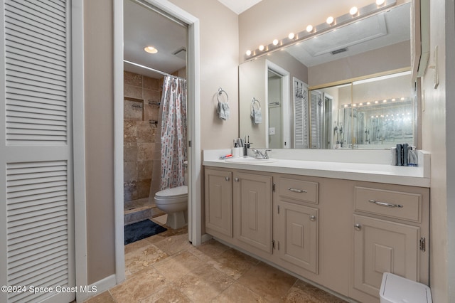 bathroom with a shower with shower curtain, vanity, and toilet