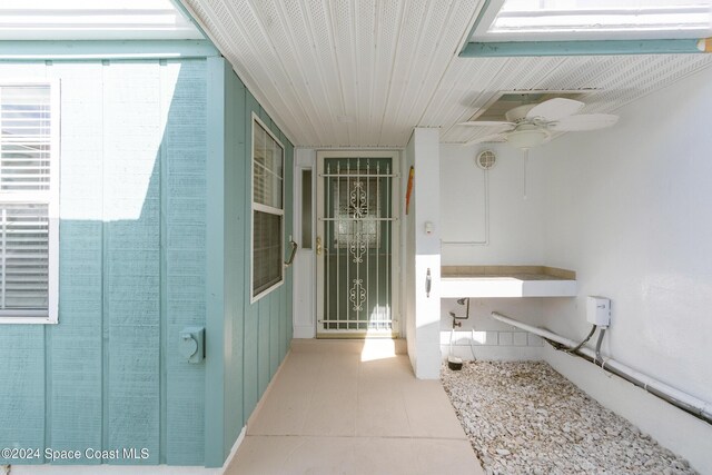 204 Queens Ct, Satellite Beach, FL 32937 - doorway to property with a ceiling fan