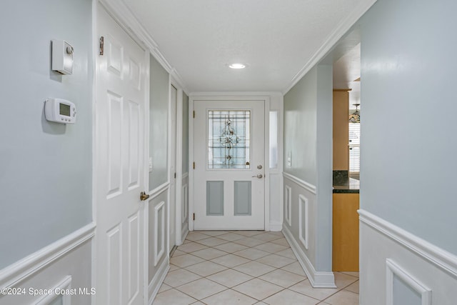 204 Queens Ct, Satellite Beach, FL 32937 - entryway featuring light tile patterned floors, wainscoting, a decorative wall, ornamental molding, and recessed lighting