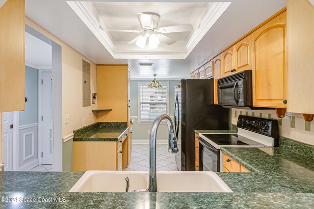 204 Queens Ct, Satellite Beach, FL 32937 - kitchen featuring range with electric cooktop, black microwave, dark countertops, a sink, and light brown cabinets
