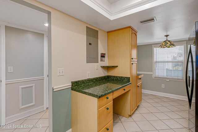 204 Queens Ct, Satellite Beach, FL 32937 - kitchen featuring electric panel, light tile patterned floors, dark countertops, freestanding refrigerator, and baseboards