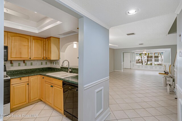 204 Queens Ct, Satellite Beach, FL 32937 - kitchen featuring black appliances, a sink, open floor plan, dark countertops, and light tile patterned floors