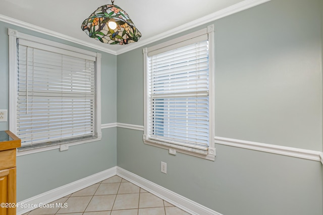204 Queens Ct, Satellite Beach, FL 32937 - spare room with baseboards, light tile patterned floors, and crown molding