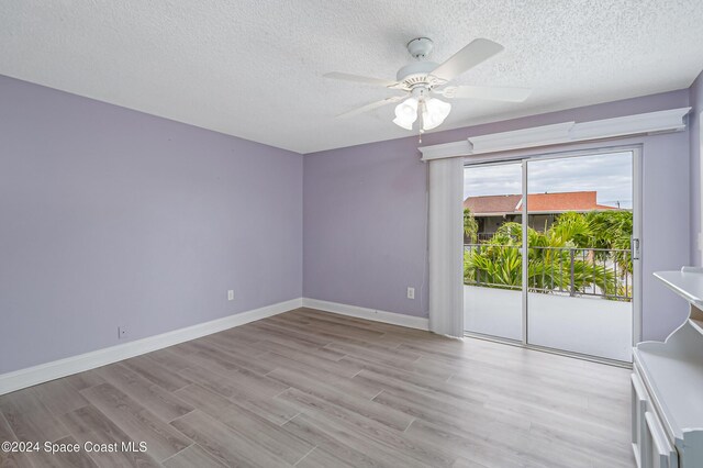 204 Queens Ct, Satellite Beach, FL 32937 - empty room with a ceiling fan, a textured ceiling, light wood-type flooring, and baseboards
