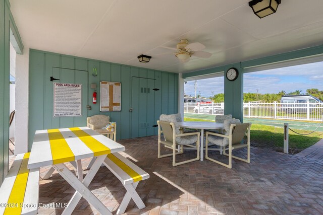 204 Queens Ct, Satellite Beach, FL 32937 - view of patio / terrace featuring a ceiling fan and outdoor dining space