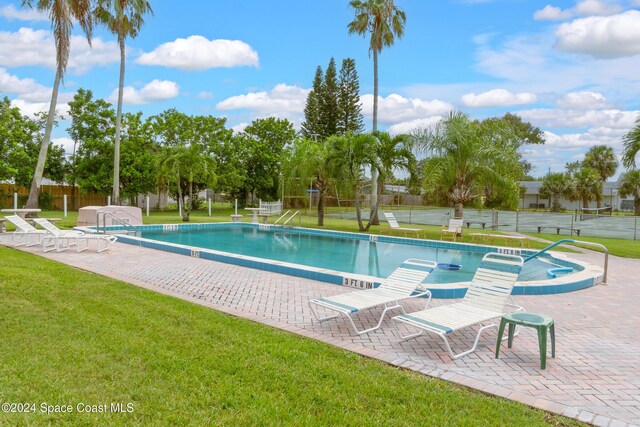 204 Queens Ct, Satellite Beach, FL 32937 - community pool featuring a patio