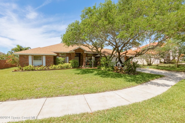 ranch-style home with a front lawn