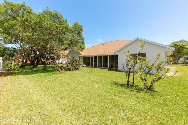 view of yard featuring a sunroom