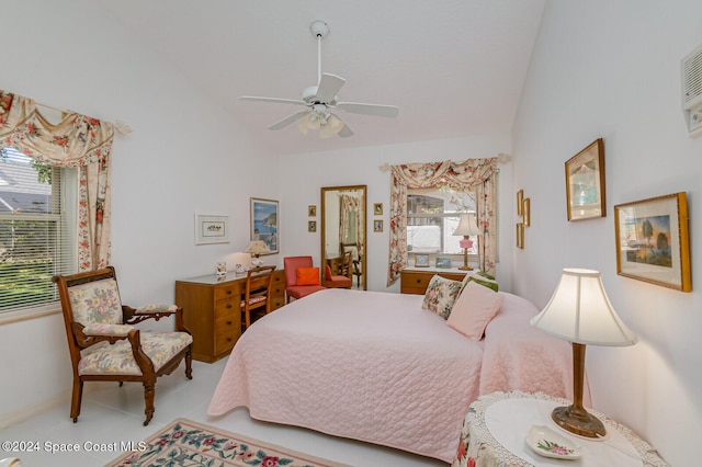 bedroom featuring ceiling fan, multiple windows, and vaulted ceiling