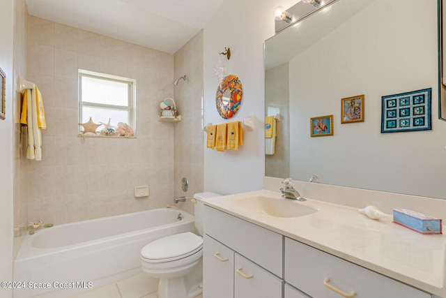 full bathroom with toilet, vanity, tiled shower / bath, and tile patterned flooring