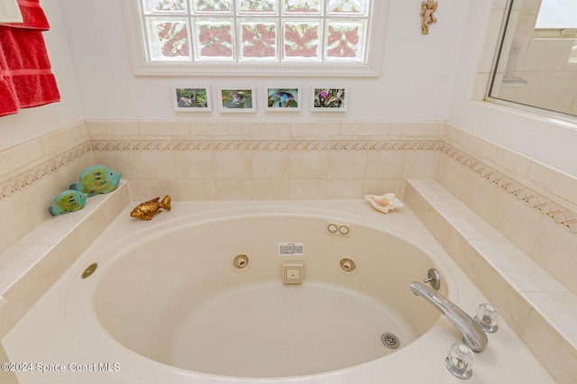 bathroom featuring tiled bath