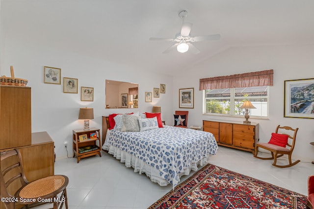 tiled bedroom with vaulted ceiling and ceiling fan