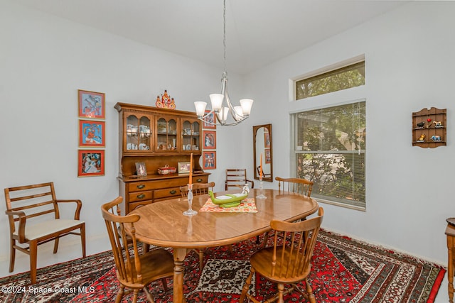 dining space with a notable chandelier