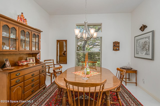 dining area featuring an inviting chandelier