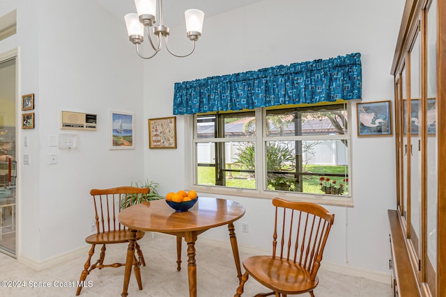 tiled dining space with a notable chandelier and lofted ceiling