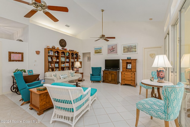 living room featuring ceiling fan, light tile patterned floors, and high vaulted ceiling