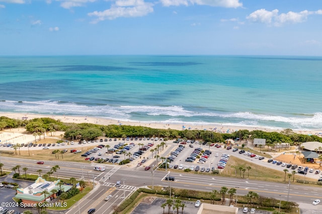 bird's eye view with a view of the beach and a water view