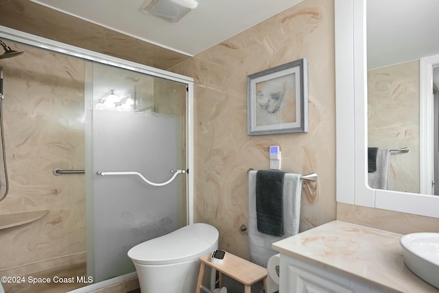 bathroom with vanity, toilet, and walk in shower