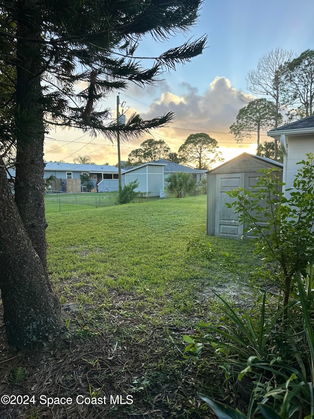 yard at dusk with a shed