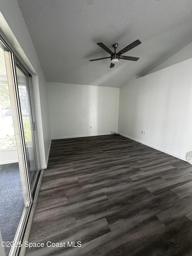 spare room featuring ceiling fan, dark hardwood / wood-style flooring, and a textured ceiling