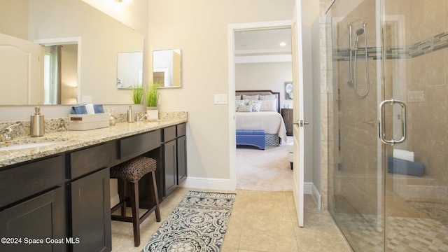 bathroom featuring vanity, tile patterned floors, and a shower with shower door