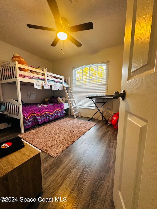 bedroom with ceiling fan and hardwood / wood-style floors