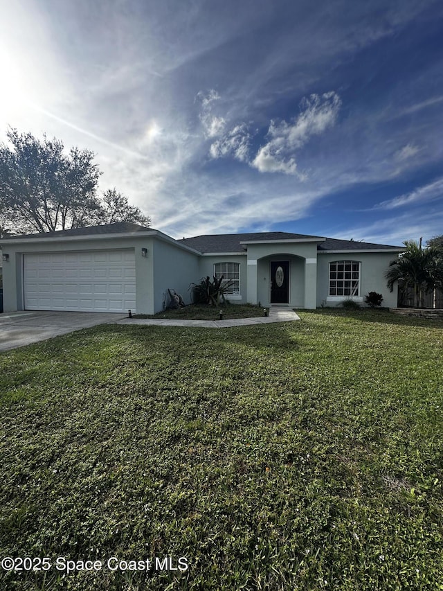 ranch-style home with a front yard and a garage